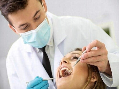 Nhổ răng khôn bị sốt: Nguyên nhân, tác hại, cách khắc phục - Nha Khoa Home